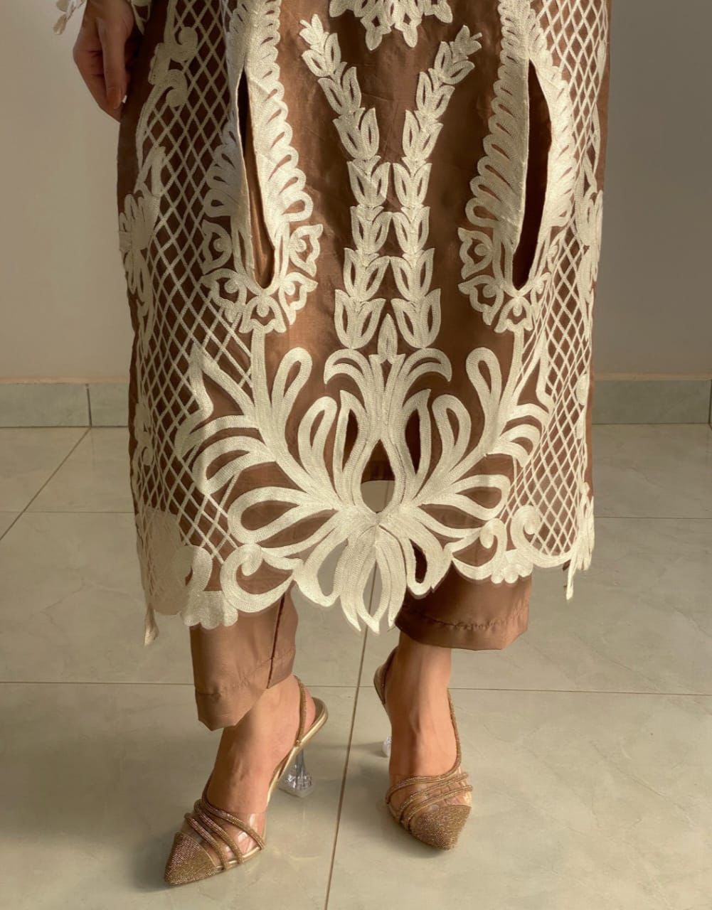 Brown Pakistani dress with intricate floral embroidery