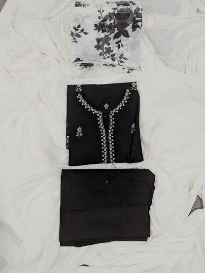 Elegant black Pakistani embroidered suit for women