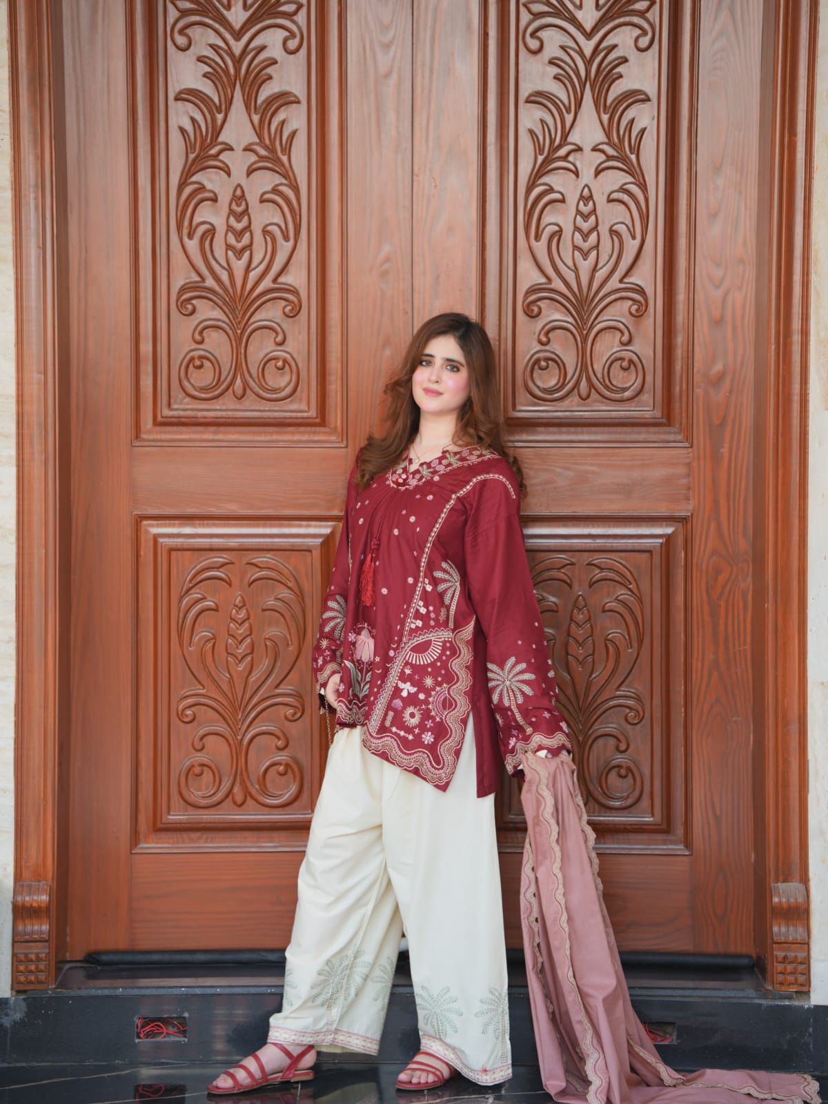 Maroon Pakistani embroidered suit with off-white trousers