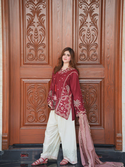 Maroon Pakistani embroidered suit with off-white trousers