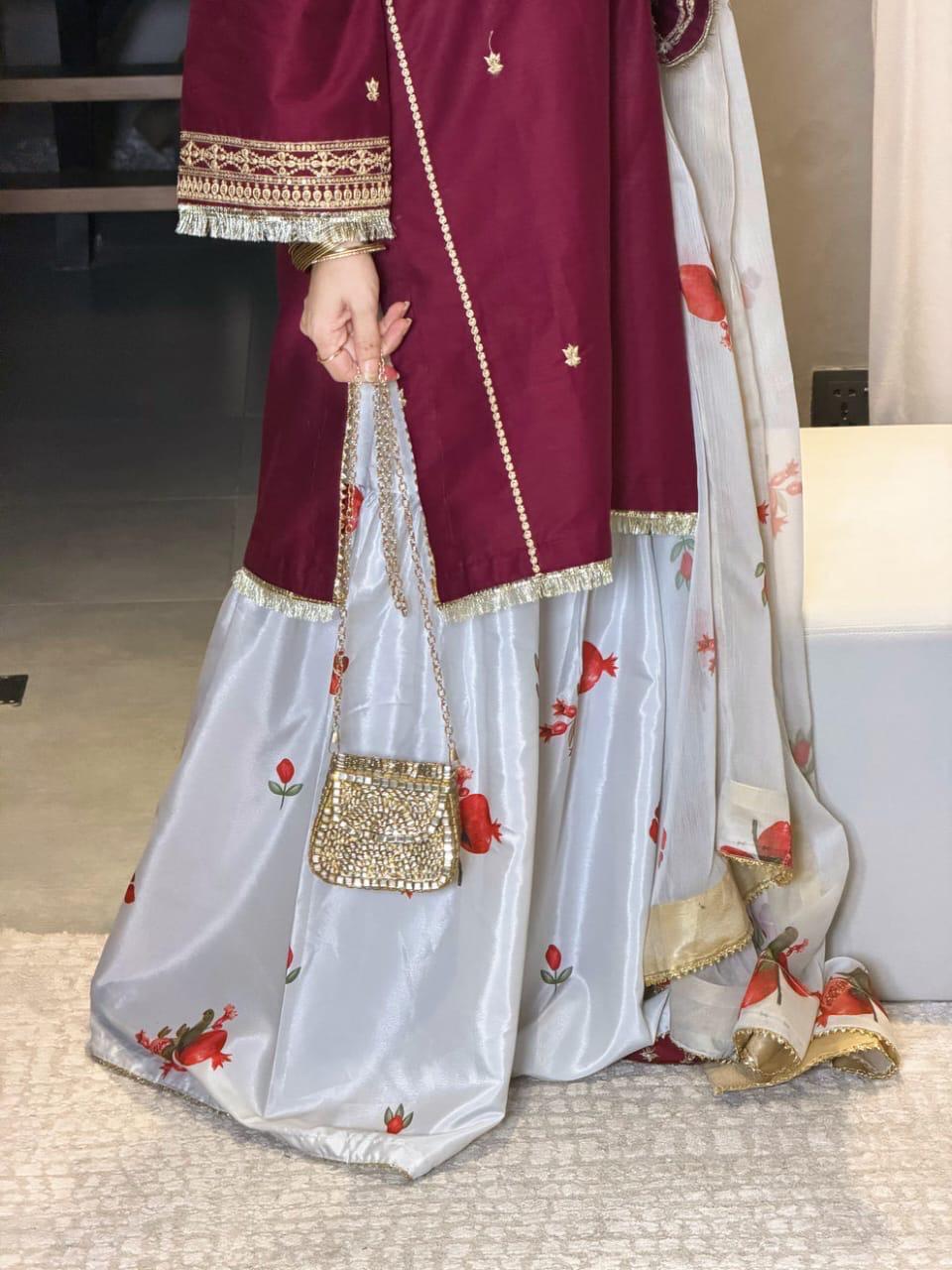 Close view of maroon embroidered women's dress by Janan Collection