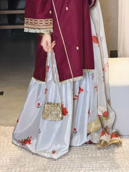 Close view of maroon embroidered women's dress by Janan Collection