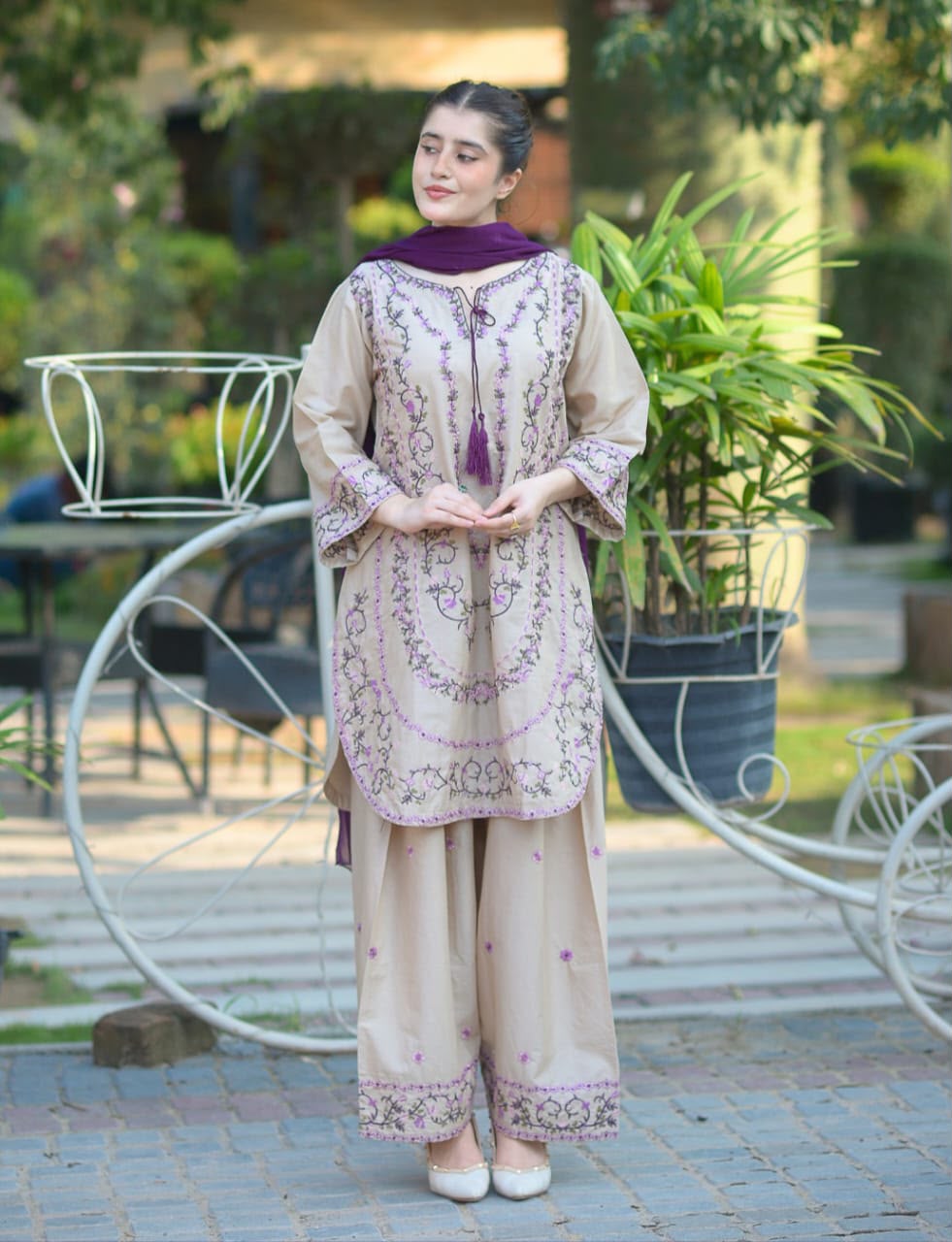 Women wearing elegant cream and purple floral embroidered 3 piece lawn suit